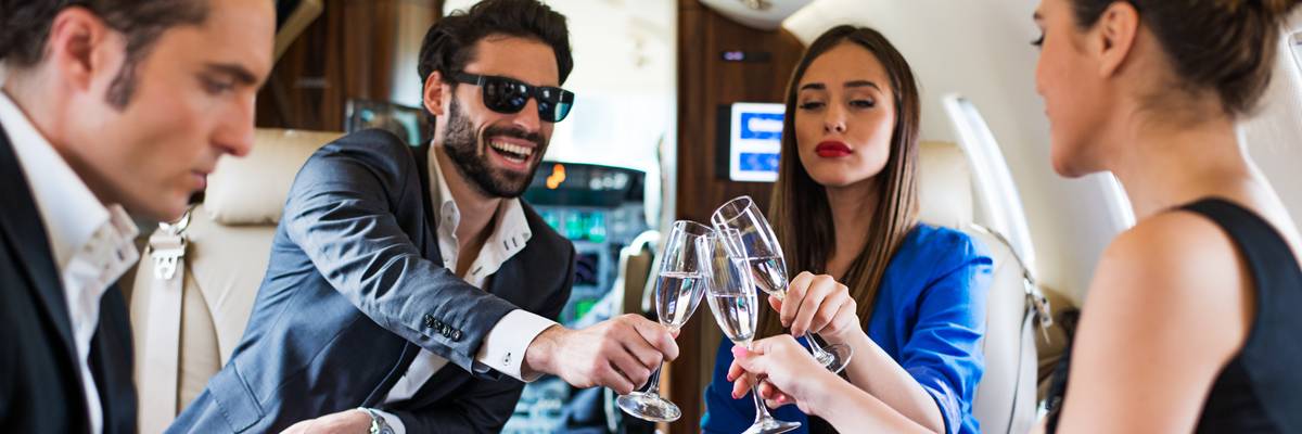 Group toast aboard a private jet
