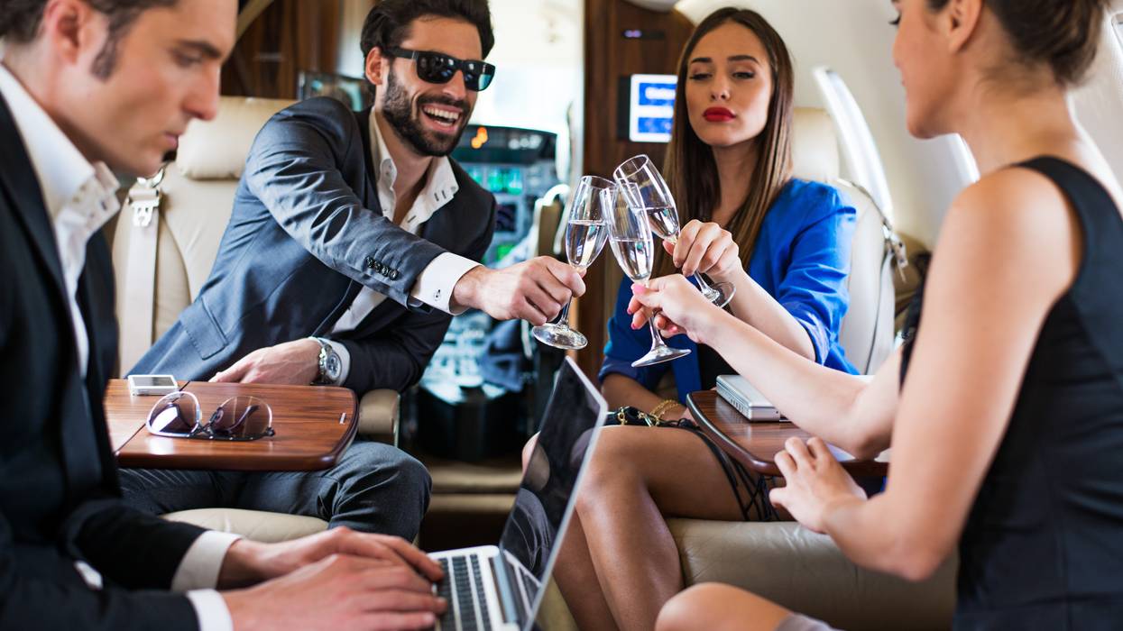 Group toast aboard a private jet