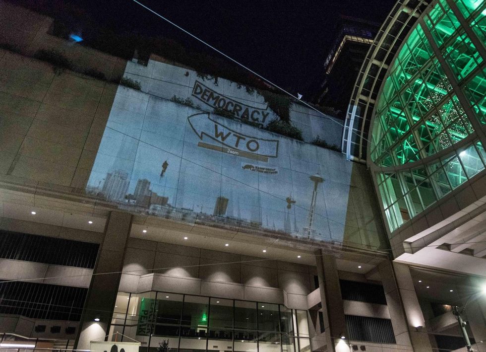 Guerrilla projection on the site on the WTO Meet 20 years before. (Photo: Elliot Stoller)