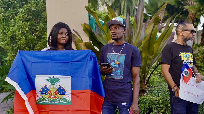 Haitians protest outside Puerto Rico hotel.