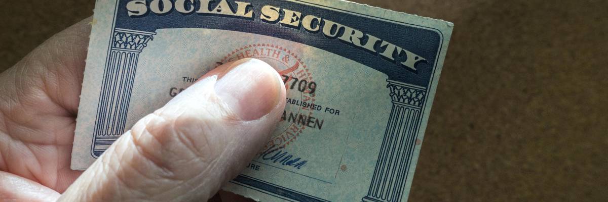 Hand holding a Social Security Card