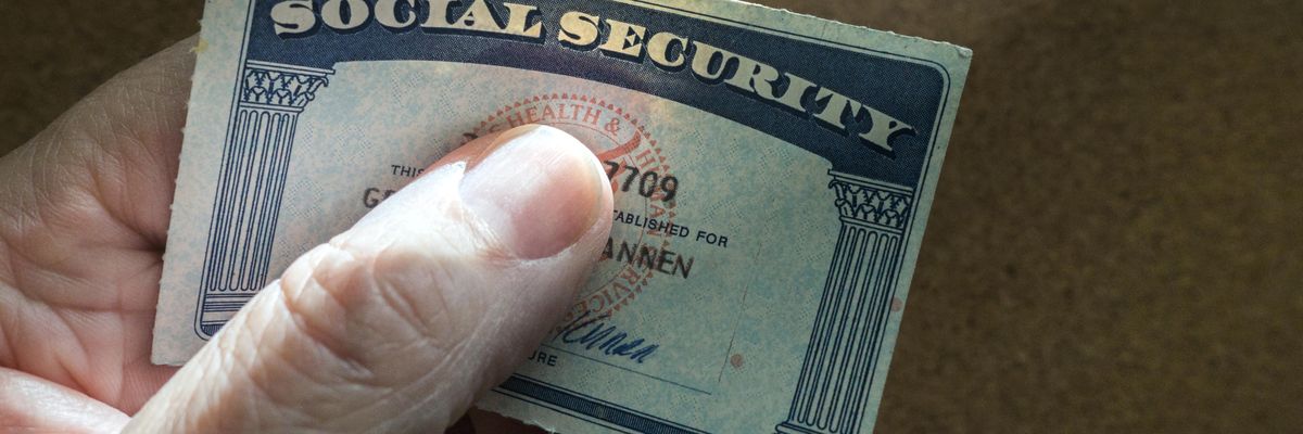 Hand holding a Social Security Card