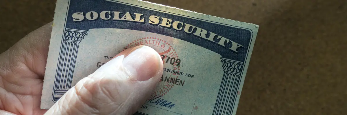 Hand holding social security card