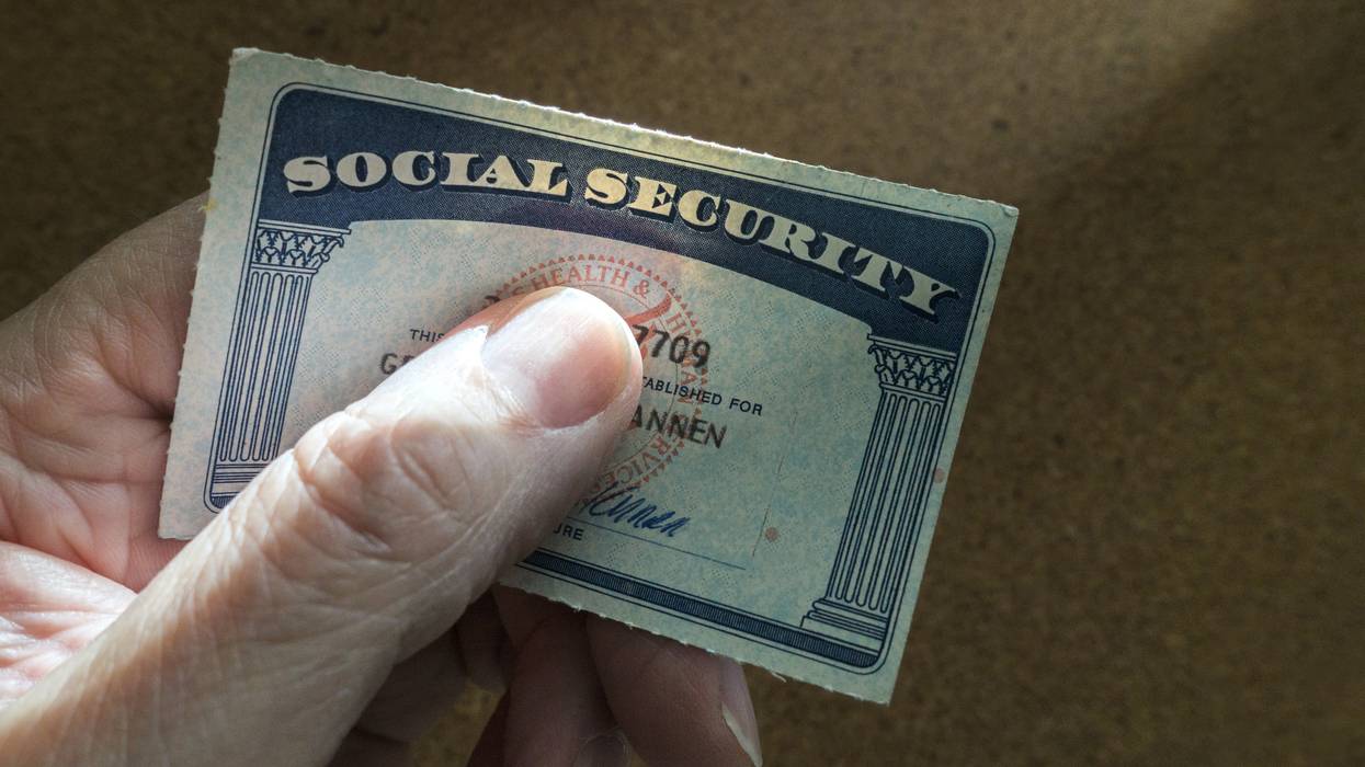 Hand holding social security card