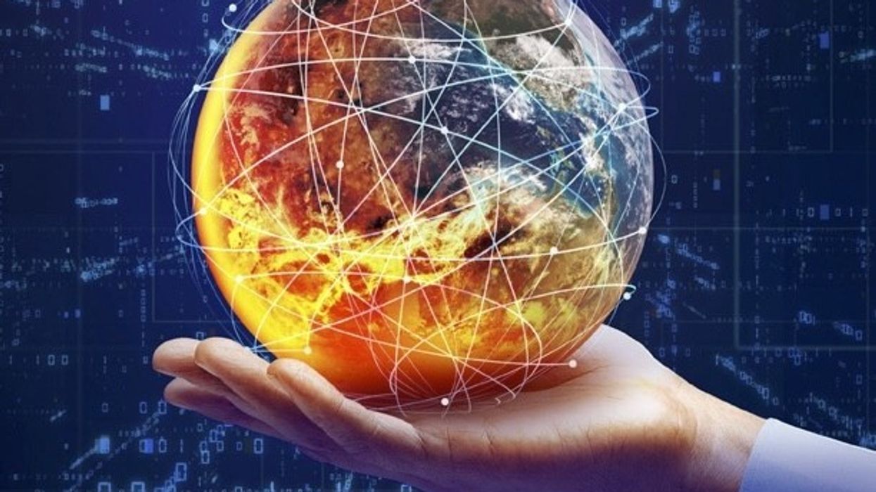 hand holds globe surrounded by code