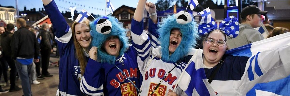 Happy Finland ice hockey fans celebrate