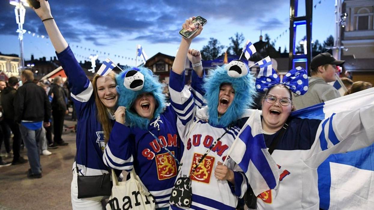 Happy Finland ice hockey fans celebrate