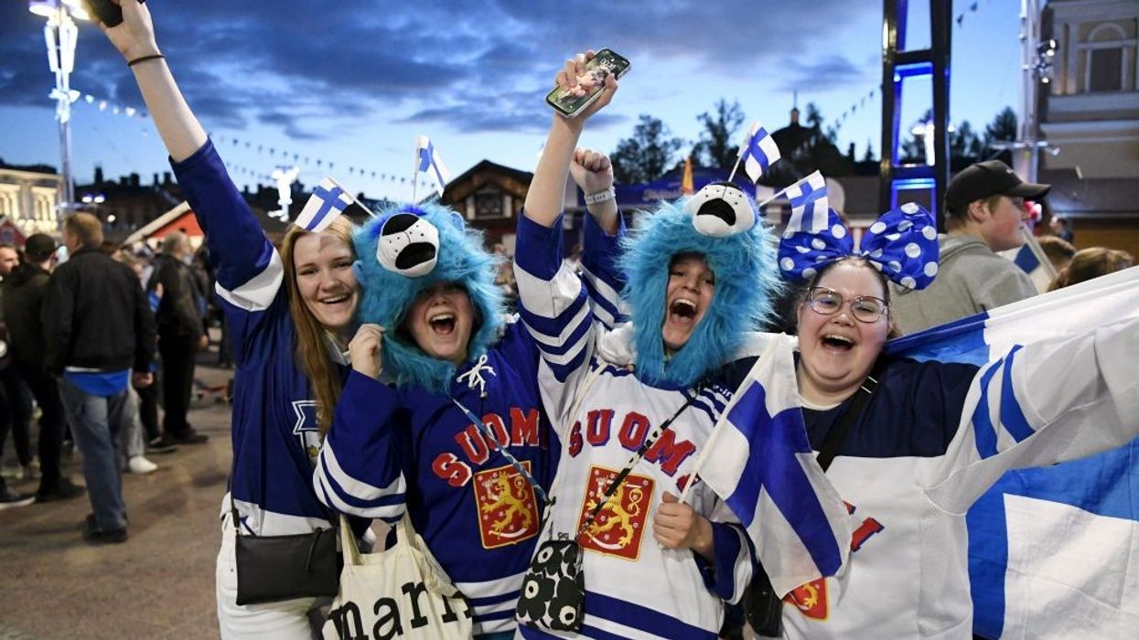 Happy Finland ice hockey fans celebrate