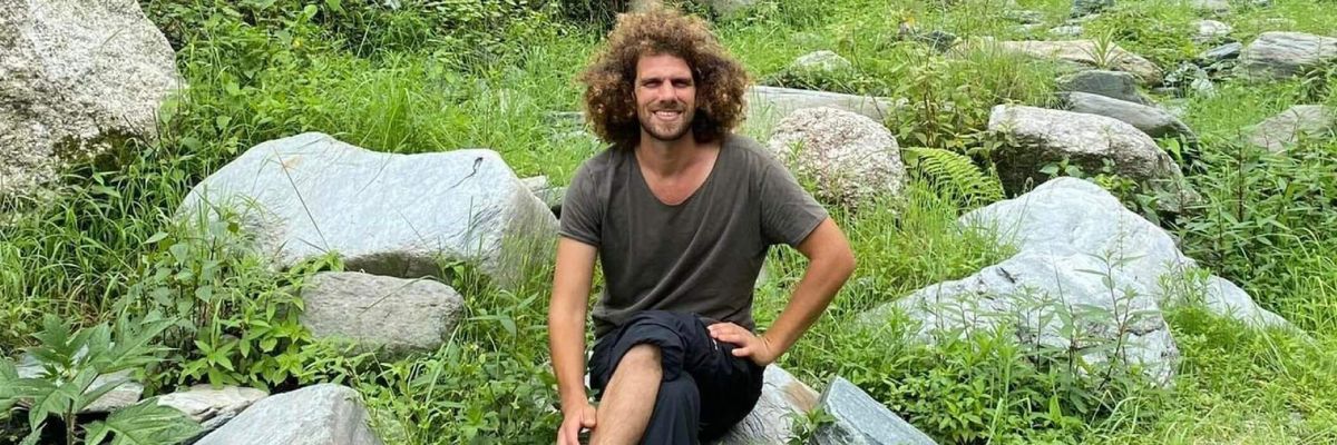 Hayim Katsman, a Jewish peace activist, sits outside Kibbutz Holit where he was murdered by Hamas