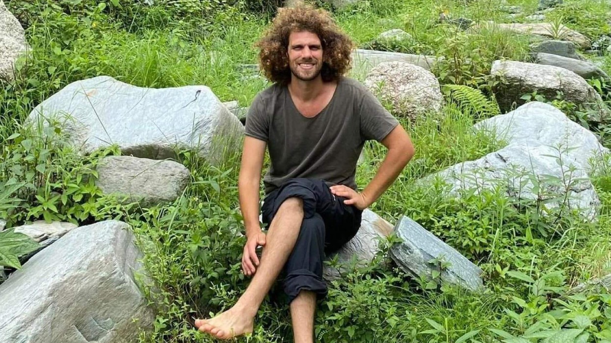 Hayim Katsman, a Jewish peace activist, sits outside Kibbutz Holit where he was murdered by Hamas