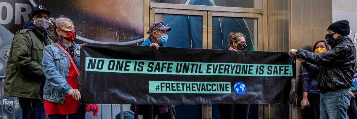 Health justice advocates demonstrated outside Pfizer's headquarters in Manhattan on March 11, 2021. (Photo: Erik McGregor/LightRocket via Getty Images)
