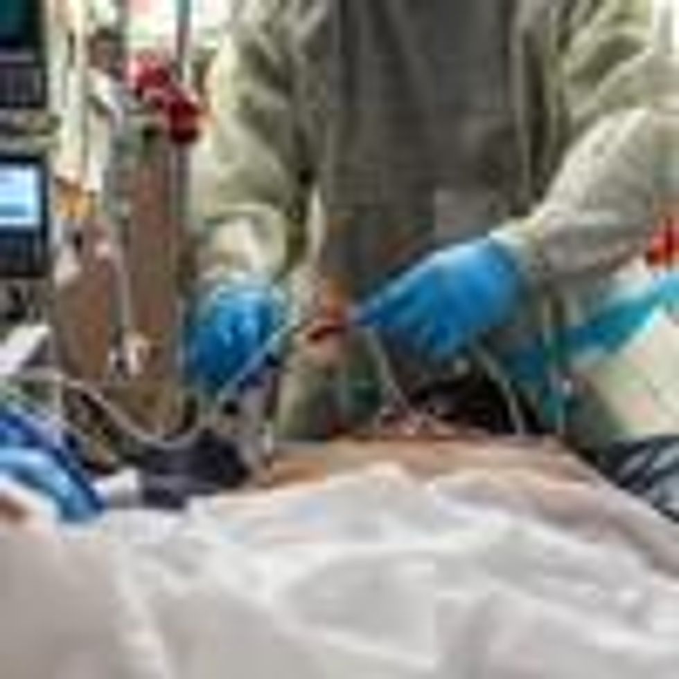 Healthcare workers attend to an unvaccinated 45-year-old Covid-19 patient