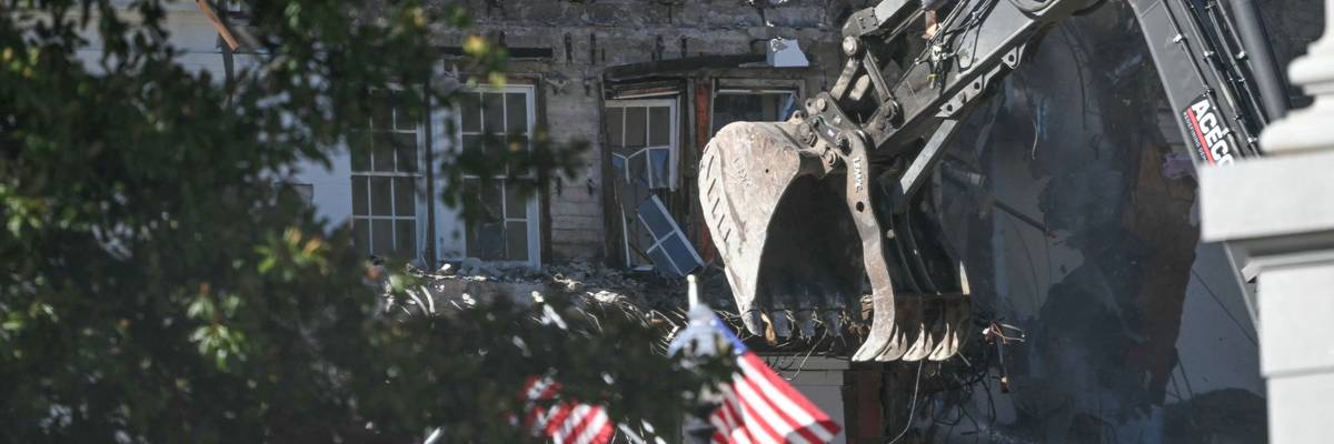 Heavy machinery tears down a section of the East Wing of the White House
