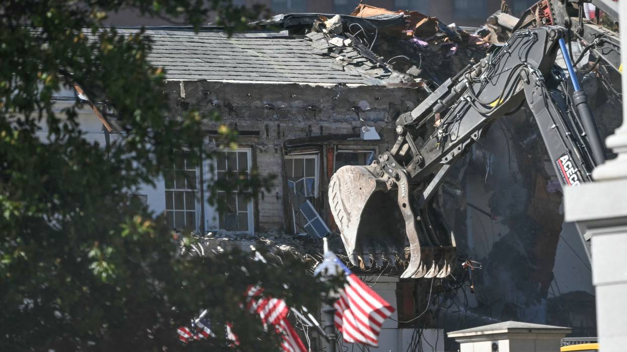 Heavy machinery tears down a section of the East Wing of the White House