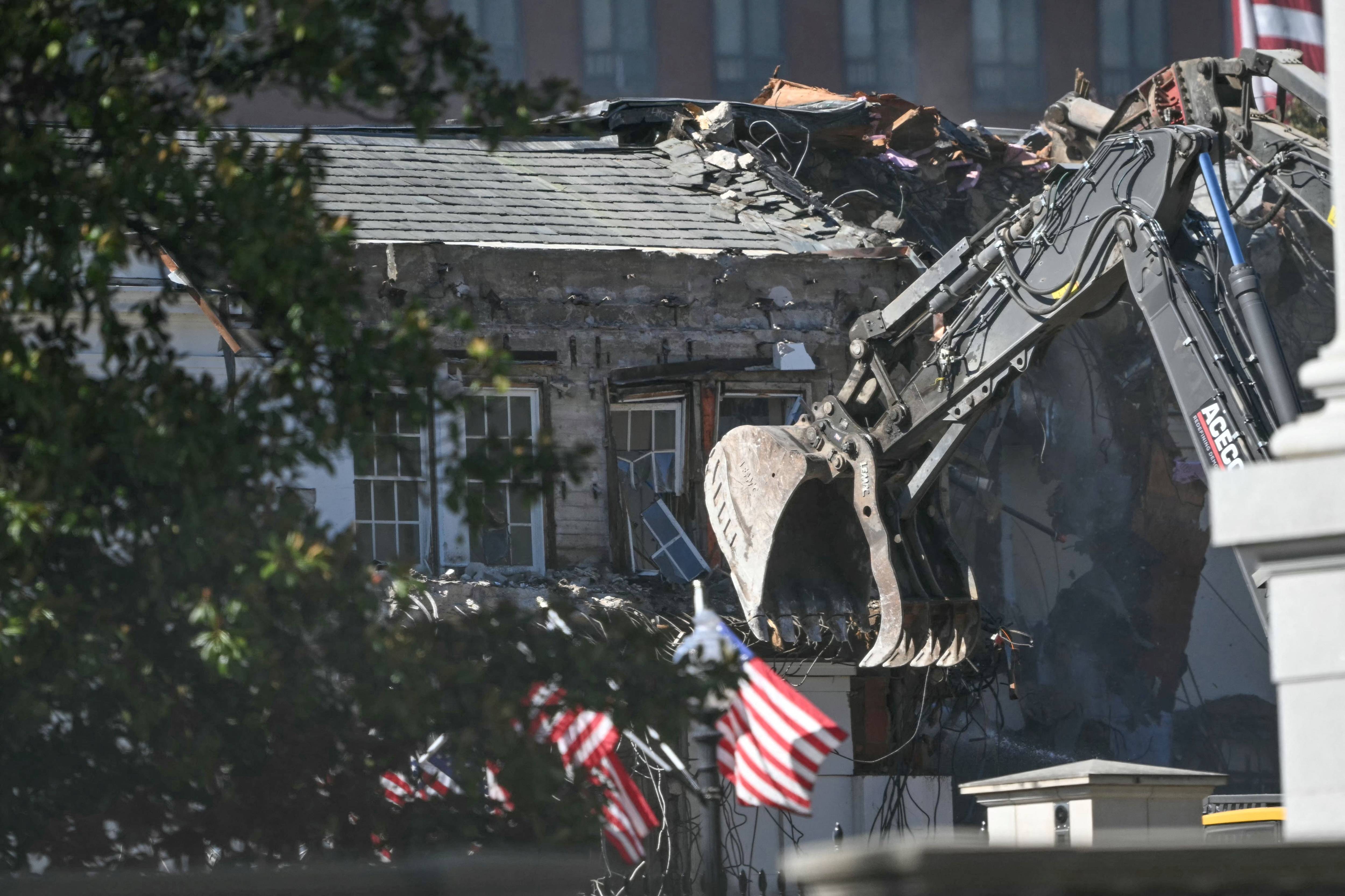 Heavy machinery tears down a section of the East Wing of the White House