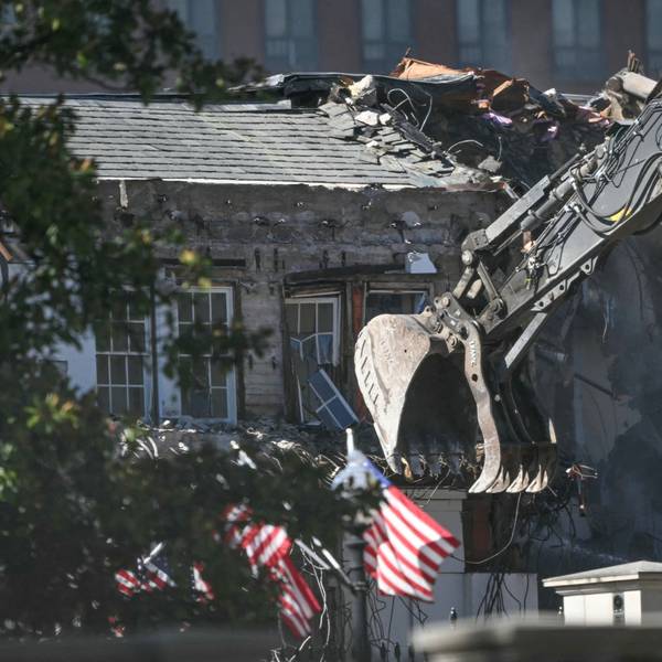Heavy machinery tears down a section of the East Wing of the White House