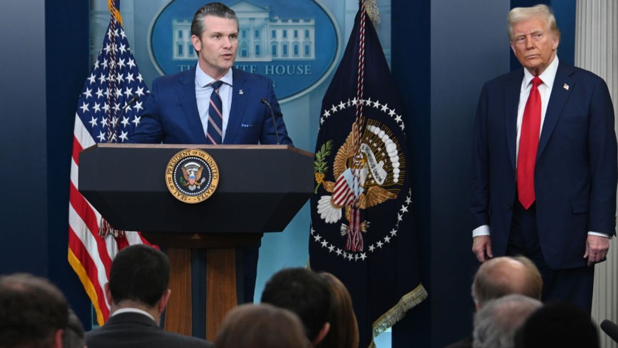 Hegseth and Trump in briefing room