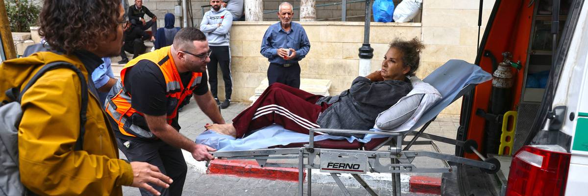 Heidi Levine on a stretcher after settler attack.