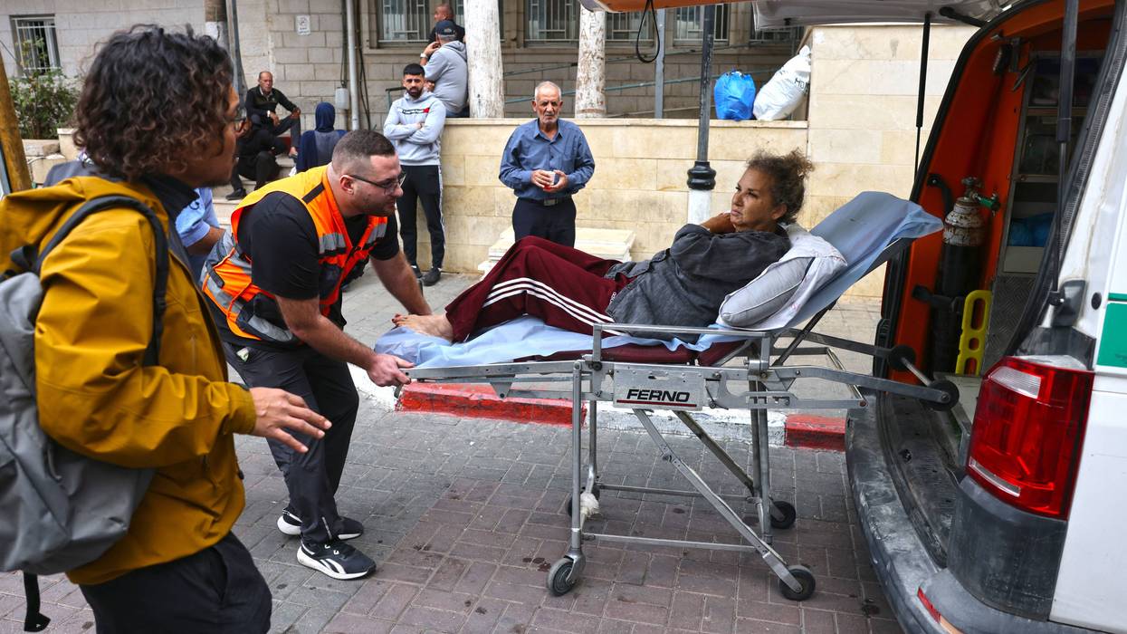 Heidi Levine on a stretcher after settler attack.