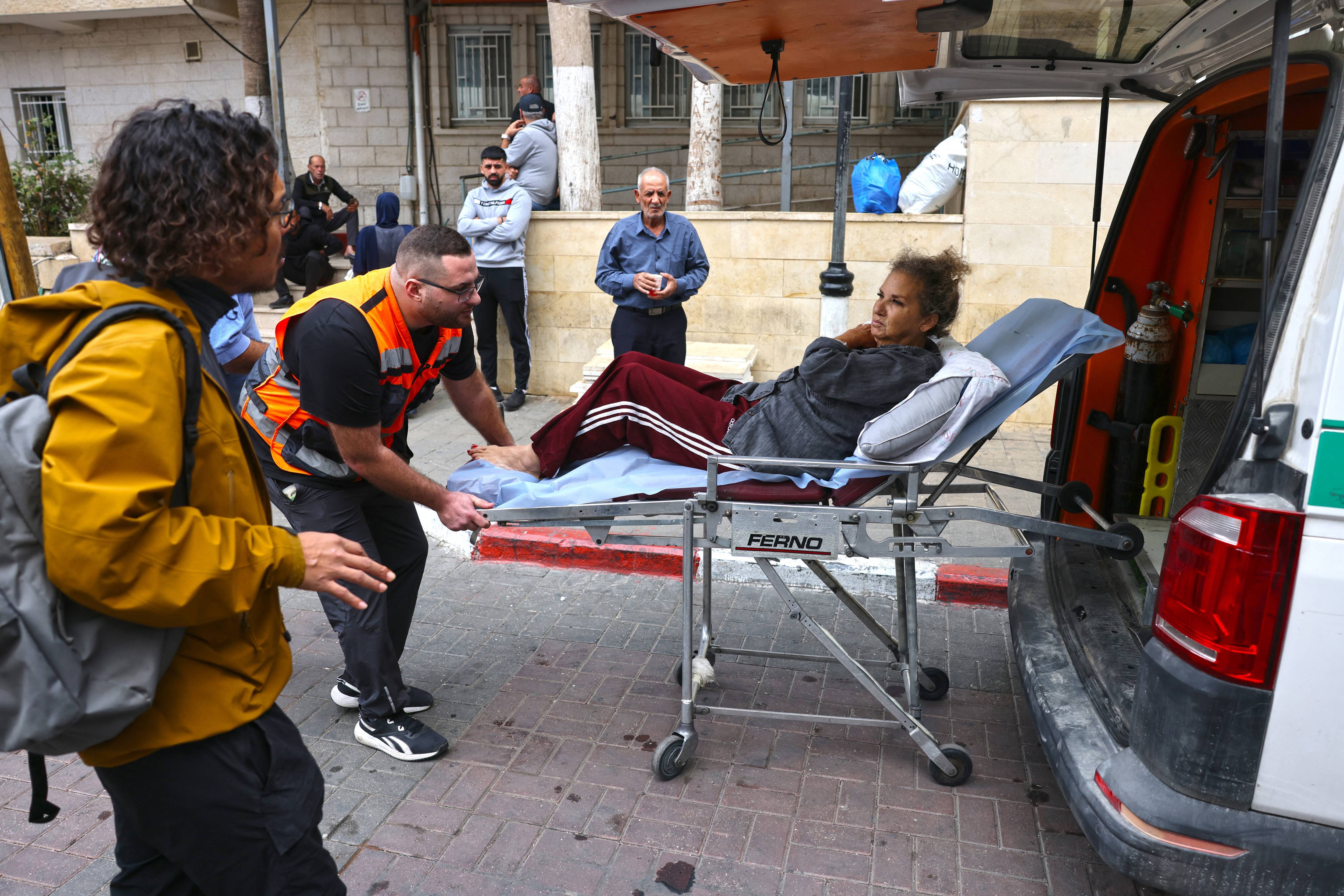 Heidi Levine on a stretcher after settler attack.
