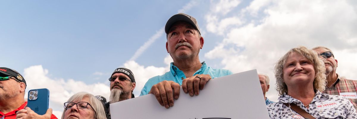 Herschel Walker supporters hold sign during rally for US Republican candidate in Georgia