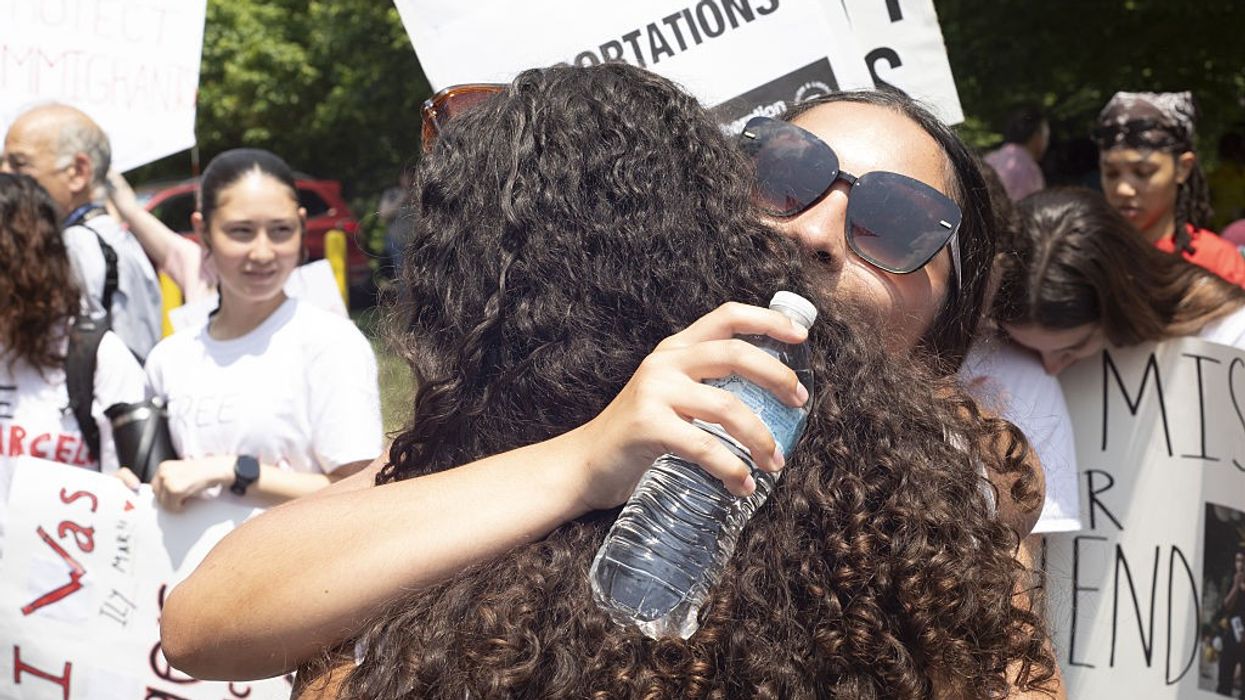 High school students celebrate classmate's release from ICE detention.