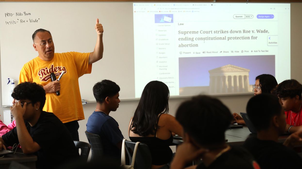 High school teacher educating students