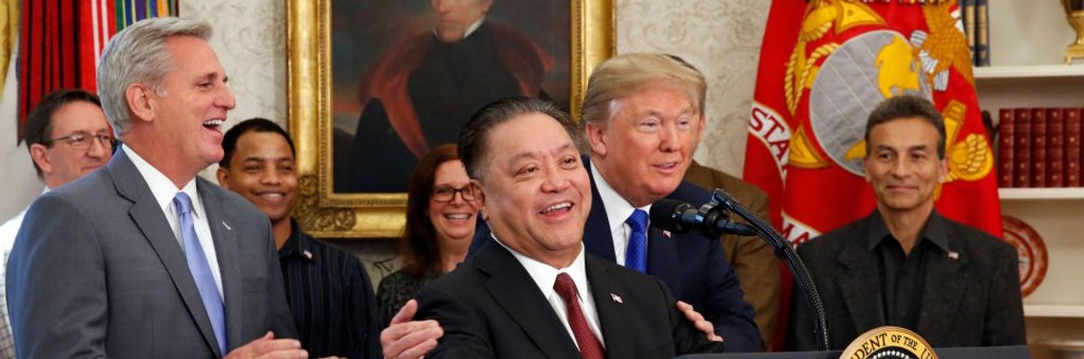 Hock Tan at White House lectern with Donald Trump in 2017