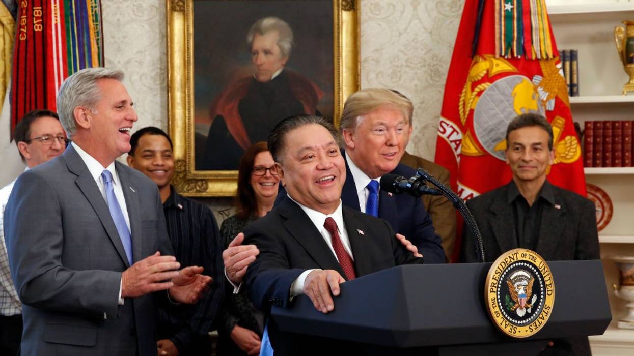 Hock Tan at White House lectern with Donald Trump in 2017