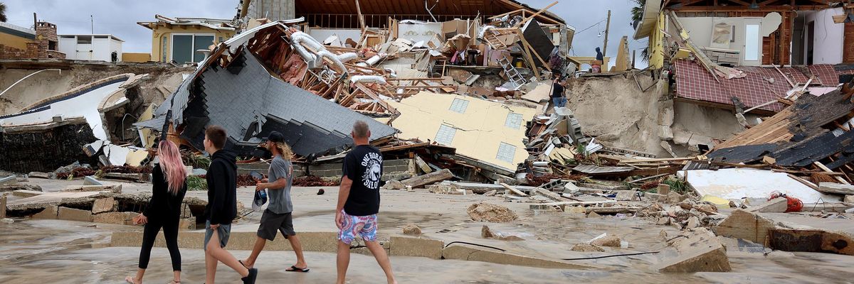 Homes are partially toppled onto the beach after Hurricane Nicole came ashore on November 10, 2022 in Daytona Beach, Florida.