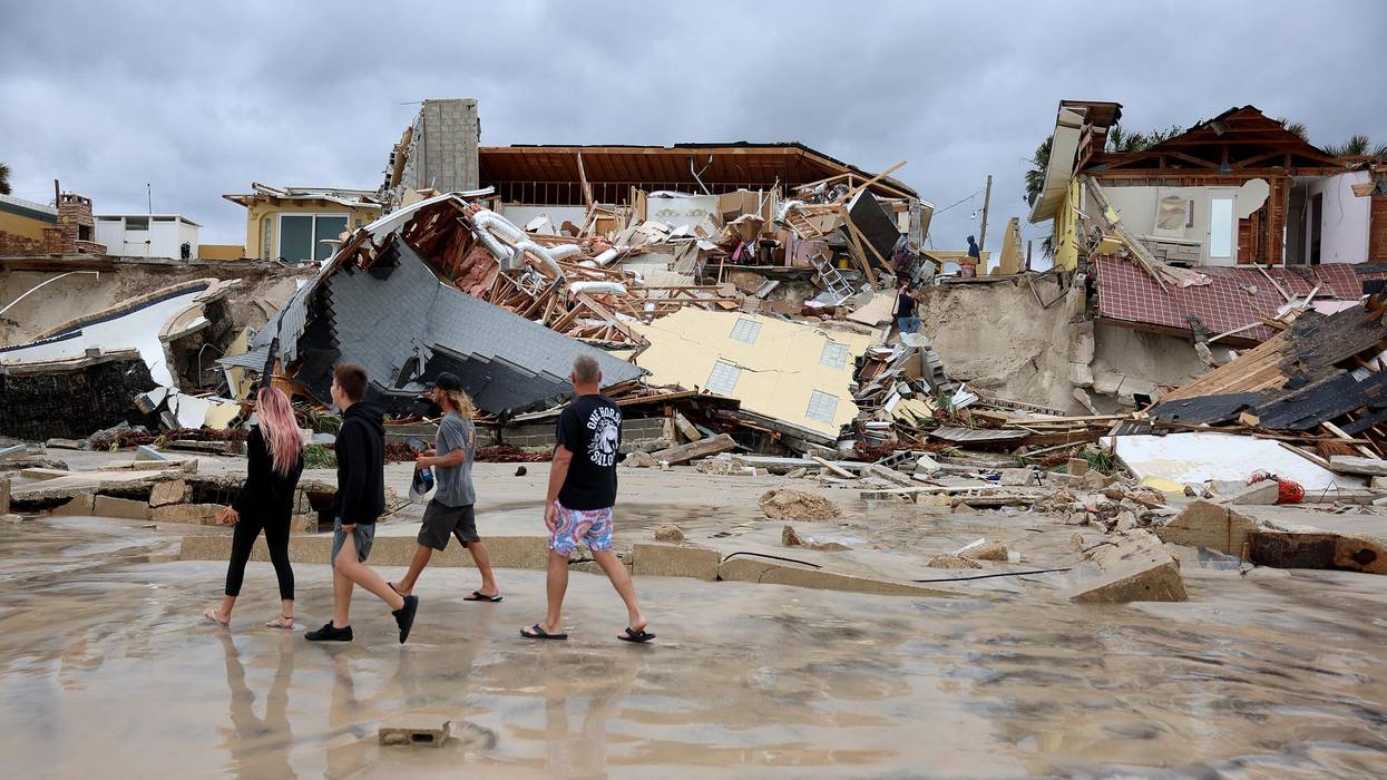 Homes are partially toppled onto the beach after Hurricane Nicole came ashore on November 10, 2022 in Daytona Beach, Florida.