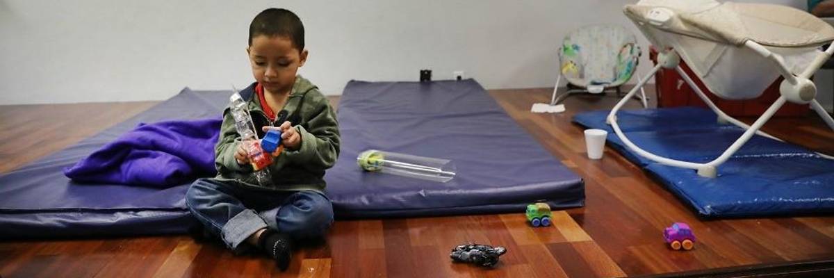 Honduran child plays after crossing border.