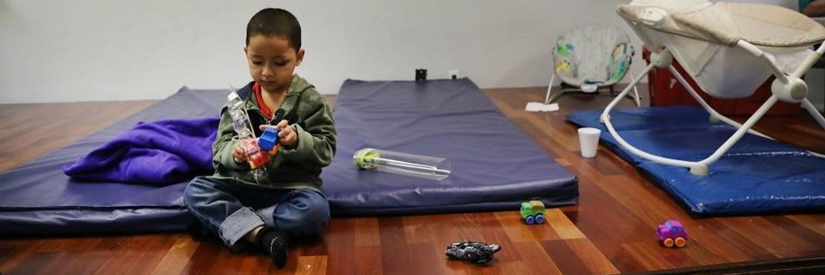 Honduran child plays after crossing border.