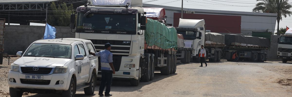 Humanitarian aid trucks line up at Rafah crossing