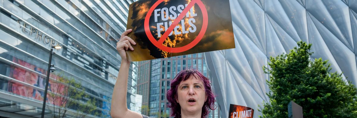 Hundreds of climate activists gathered outside the CNN studios