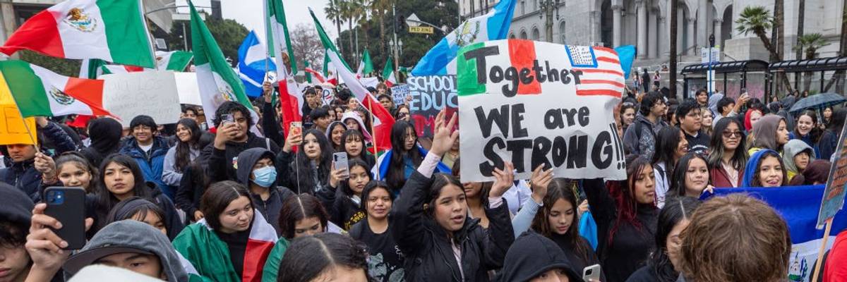 Hundreds of protestors gather outside Los Angeles City Hall and march to protest Trump's immigration policy.