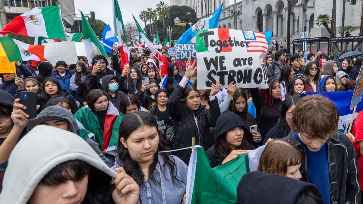 Hundreds of protestors gather outside Los Angeles City Hall and march to protest Trump's immigration policy.