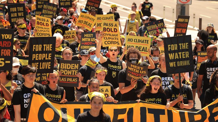 Hundreds of young climate activists march along Pennsylvania Avenue to the White House to demand that U.S. President Joe Biden work to make the Green New Deal into law on June 28, 2021 in Washington, D.C.