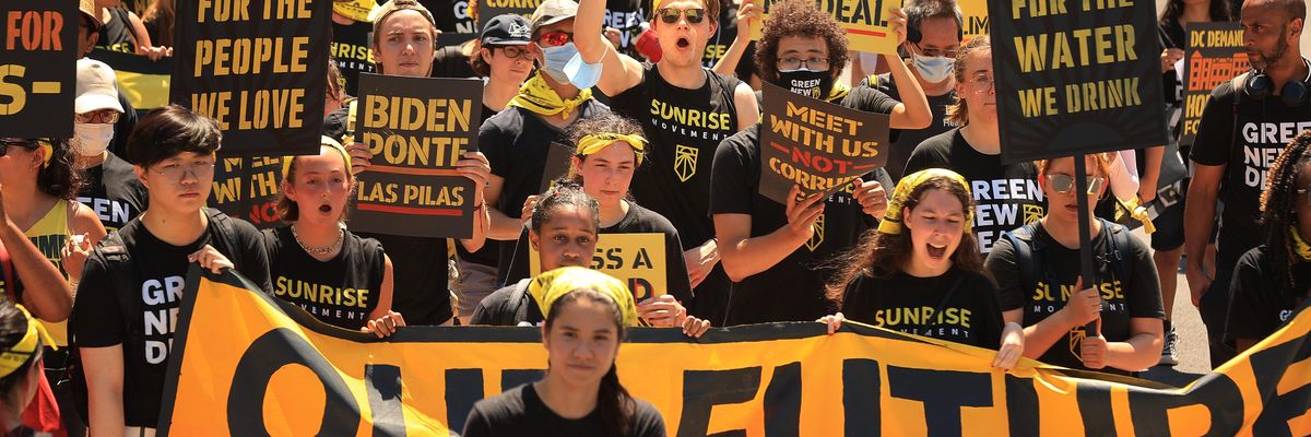 Hundreds of young climate activists march along Pennsylvania Avenue to the White House to demand that U.S. President Joe Biden work to make the Green New Deal into law on June 28, 2021 in Washington, D.C.