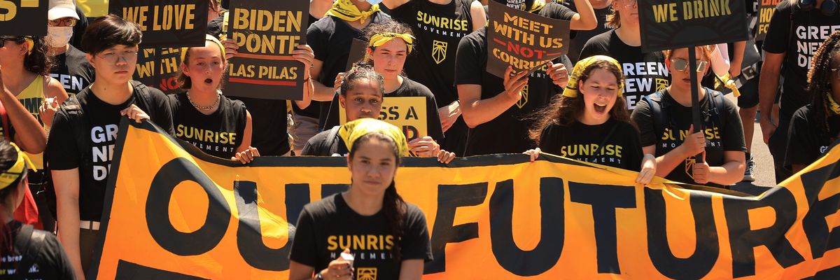 Hundreds of young climate activists march along Pennsylvania Avenue to the White House to demand that U.S. President Joe Biden work to make the Green New Deal into law on June 28, 2021 in Washington, D.C.