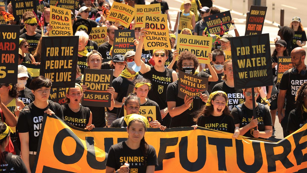 Hundreds of young climate activists march along Pennsylvania Avenue to the White House to demand that U.S. President Joe Biden work to make the Green New Deal into law on June 28, 2021 in Washington, D.C.