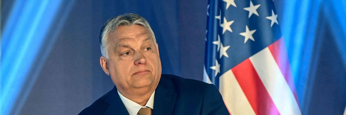 Hungarian Prime Minister Viktor Orban stands in front of a US flag after addressing a keynote speech during an extraordinary session of the Conservative Political Action Conference (CPAC) at the Balna cultural centre of Budapest, Hungary on May 19, 2022. - The two-day CPAC meeting is being held in Europe for the first time. (Photo by ATTILA KISBENEDEK/AFP via Getty Images)