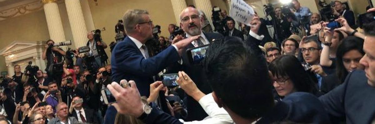 Journalist Wielding "Nuclear Weapon Ban" Sign Forcibly Ejected From Trump-Putin Presser