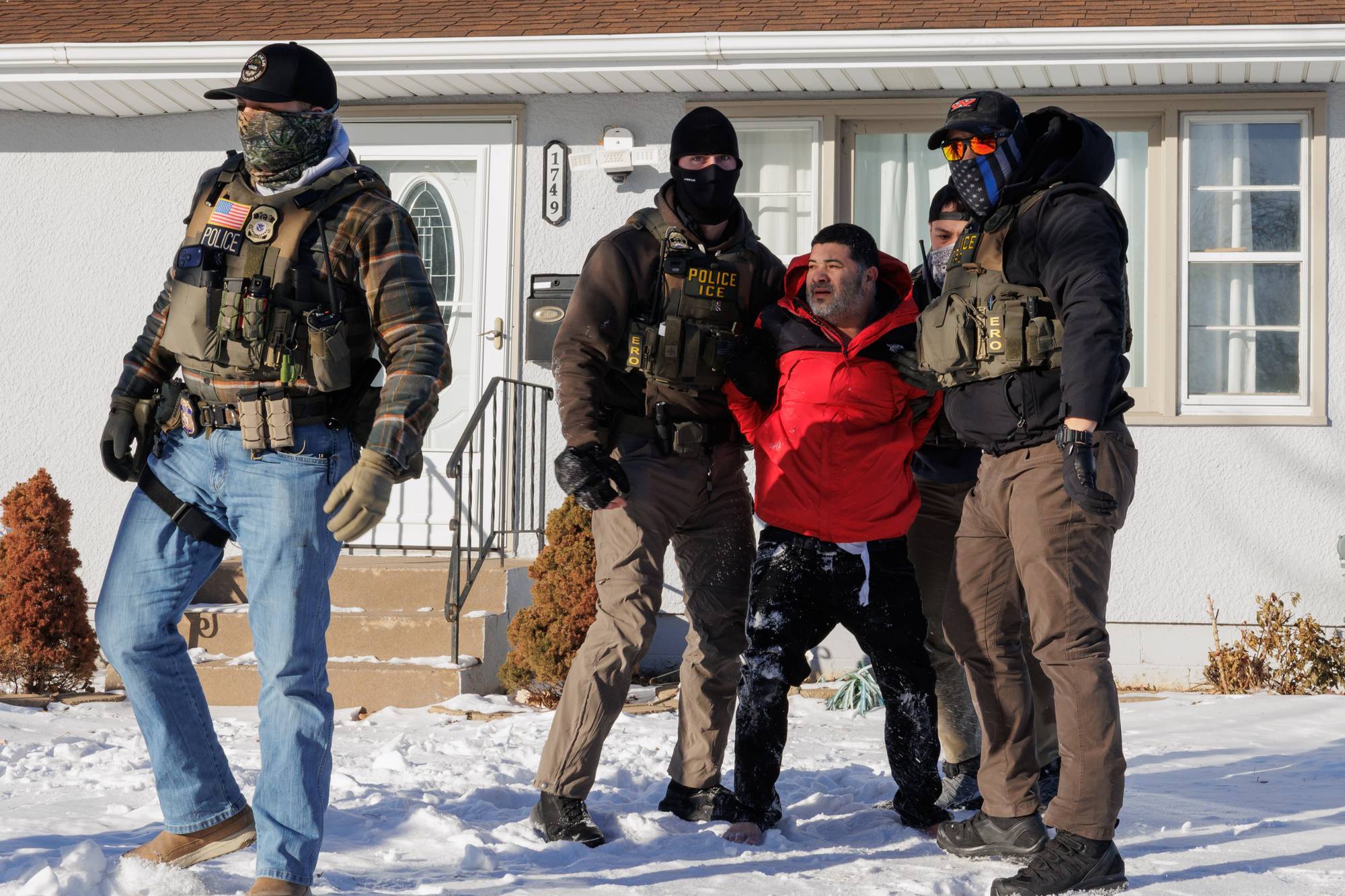 ICE Agents detain men during Federal Enforcement Operation in Minnesota
