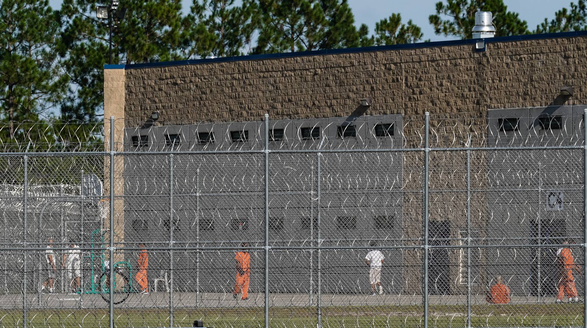 ICE detainees in yard.