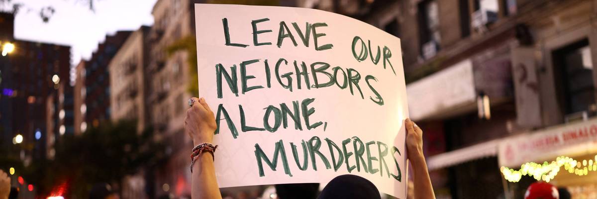 ICE protest "Leave our neighbors alone, murderers," sign says