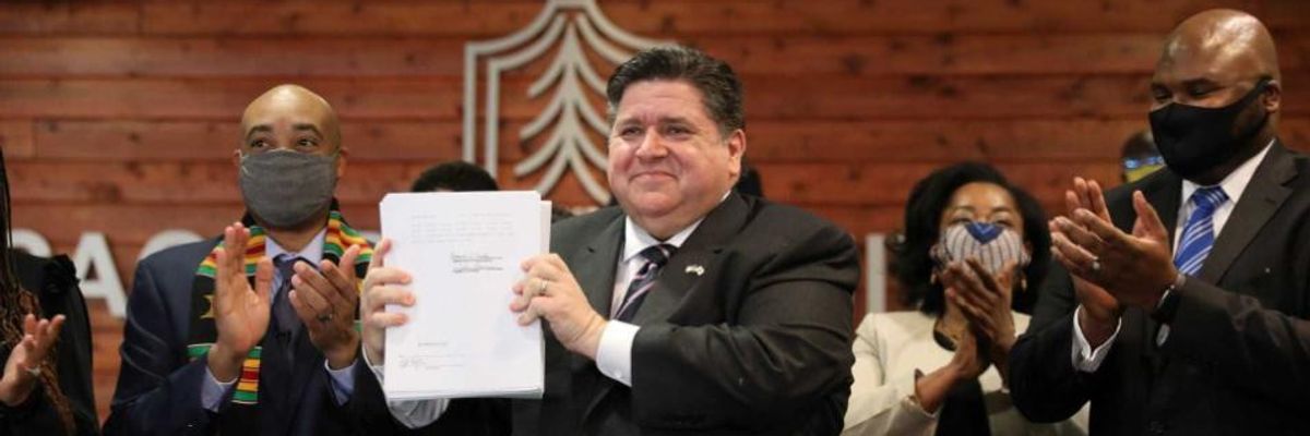 Illinois Gov. JB Pritzker with cash bail reform legislation.
