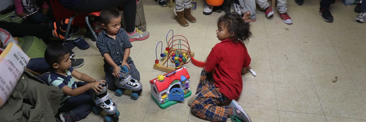 Immigrant children play at an aid center.