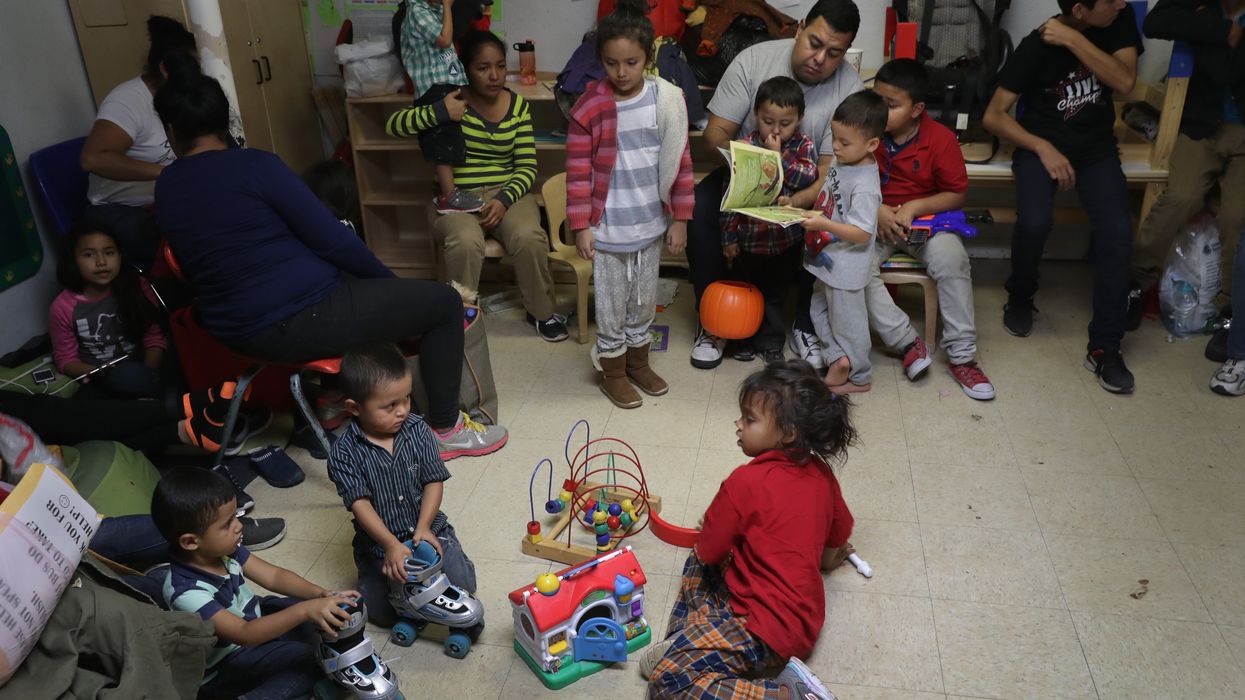 Immigrant children play at an aid center.