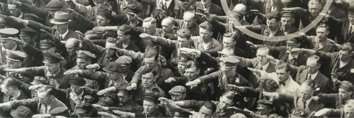 In 1930s Germany, one man stands arms crossed in a crowd of shipyard workers giving the Heil Hitler salute